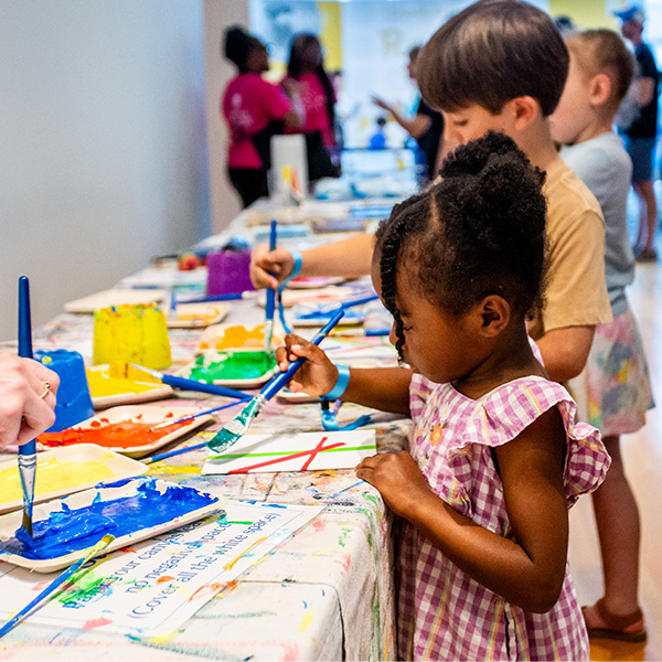 Children painting at UL Lafayette's Hilliard Art Museum for Family Fête.